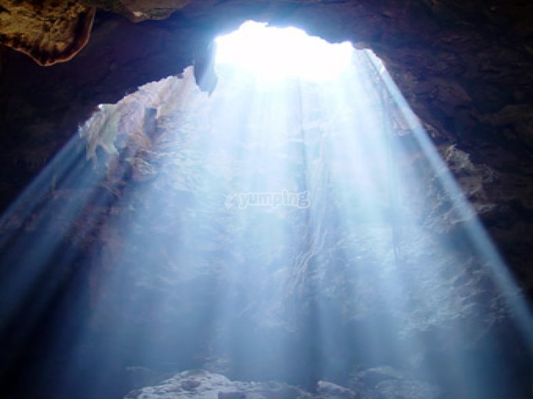 The light streaming in a enormous cave The light streaming in a enormous cave